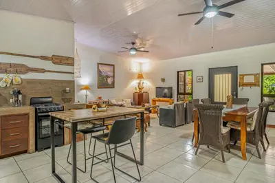 a kitchen and living room with a table and chairs at Tiburon Galano - Playa Carrillo in Carrillo