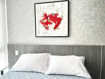 a bedroom with a red map on the wall at Luxurious 9th floor apartment in Vuelta del Virilla