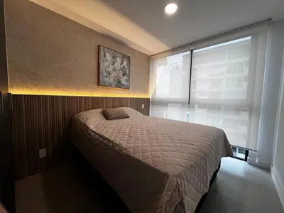 a small bedroom with a bed and a window at Luxurious 9th floor apartment in Vuelta del Virilla