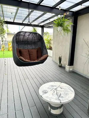 a patio with a chair and a table at Luxurious 9th floor apartment in Vuelta del Virilla