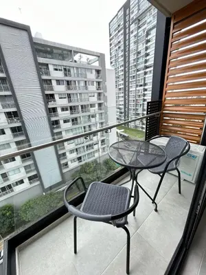 a balcony with two chairs and a table on it at Luxurious 9th floor apartment in Vuelta del Virilla