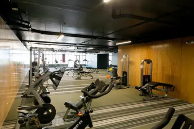 a gym with several treadmills and cardio machines at Sunset view URBN Studio 16th floor in San José