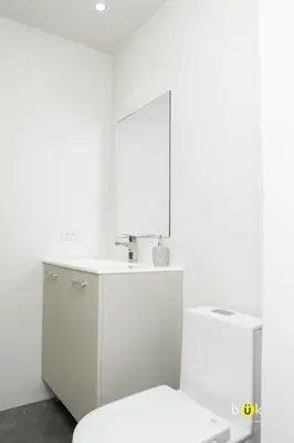 a white bathroom with a sink and a toilet at INSTAWORTHY CORNER VIEW 200Mbps in San José