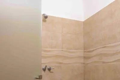 a shower with a glass door in a bathroom at Club Voca #2 in Coco