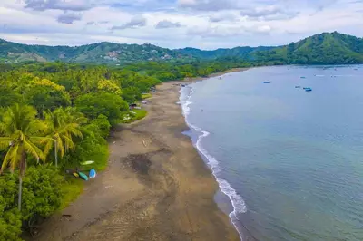 an aerial view of a beach with palm trees and water at Club Voca #2 in Coco