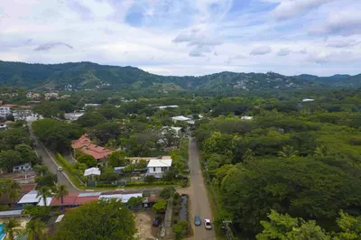 an aerial view of a town with trees and a road at Club Voca #2 in Coco