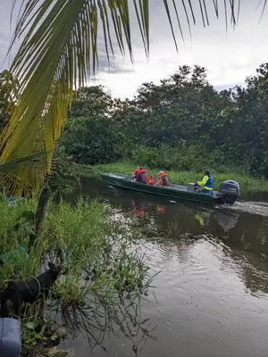 a group of people in a boat on a river at Avistamiento Fauna Flora Caribe in Puerto Limón