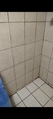 an overhead view of a shower with white tile at Avistamiento Fauna Flora Caribe in Puerto Limón