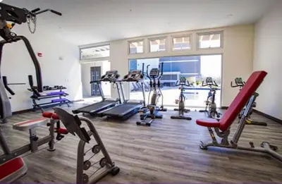 a gym with several tread machines in a room at Luxury Escape 1 Bedroom & 1 Bathroom c404 Tly in San José