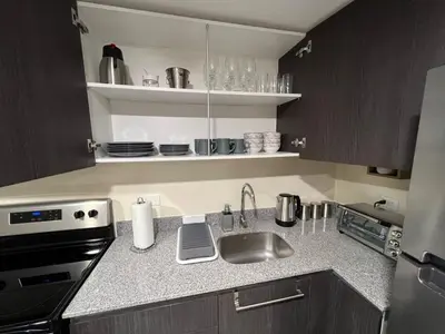a kitchen with a sink and a stove at Luxury Escape 1 Bedroom & 1 Bathroom c404 Tly in San José