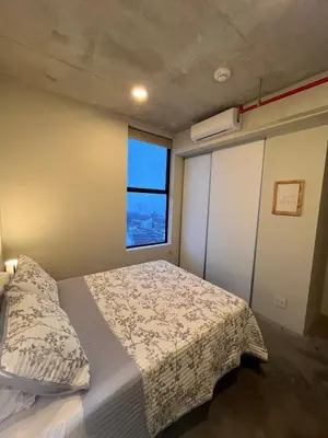 a bedroom with a bed and a window at Evening Breeze in San José
