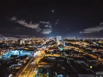 a city lit up at night with lights at Evening Breeze in San José