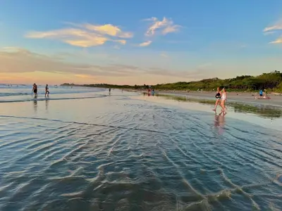 a group of people standing in the water on a beach at Villa Casa Modelo in Marbella