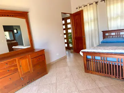a bedroom with a bed and a mirror and a dresser at Villa Casa Modelo in Marbella