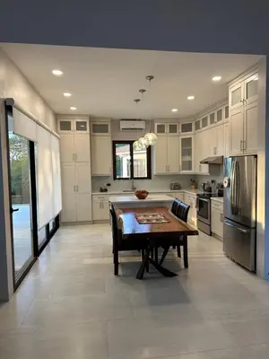 a large kitchen with a wooden table in it at Villa Dorada 55 in Marbella