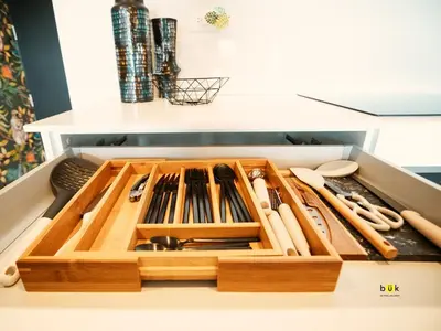a drawer filled with wooden utensils in a cabinet at Tropical Apartment URBN Escalante in San José
