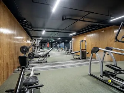 a gym with several treadmills and cardio machines at Tropical Apartment URBN Escalante in San José