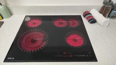 a stove with red cupcakes on top of a counter at Beautiful view in San José