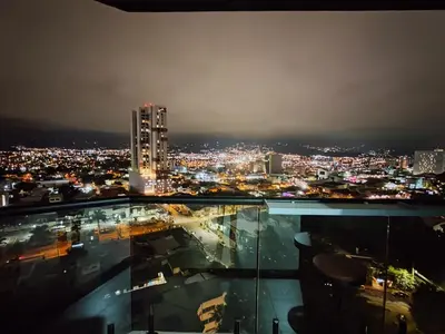 a view of a city at night at Balcony Sunset in San José
