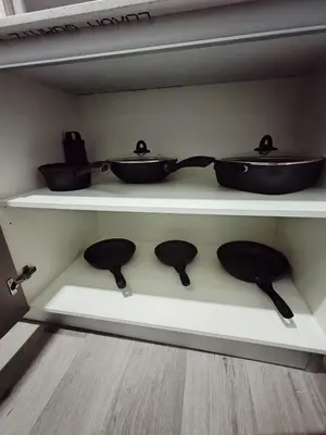 a shelf with three pots and pans on it at Balcony Sunset in San José