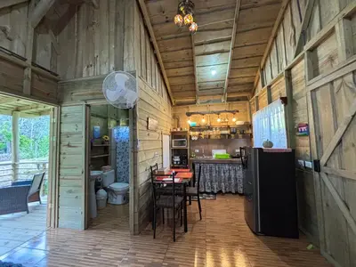 a large room with a kitchen and a dining room at Cabaña Jacaranda #2, junto al río, San Isidro, Pérez Zeledón in Roble