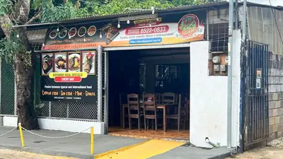 a restaurant with a sign on the front of it at Grandy Oasis Villa with Private Pool in Coco