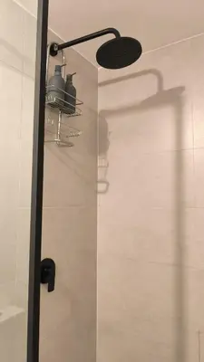 a shower in a bathroom with a glass door at Alma Verde Escalante 605 in San José