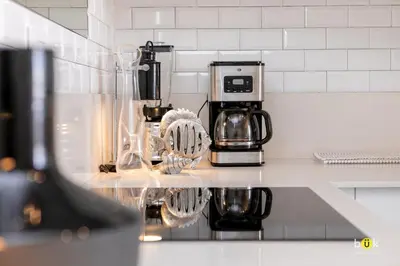 a kitchen counter with a coffee maker on it at ART AND STYLE Wonderful space for a couple in San José