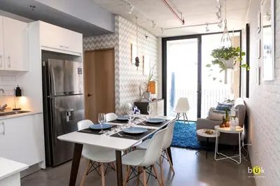 a kitchen and living room with a table and chairs at ART AND STYLE Wonderful space for a couple in San José