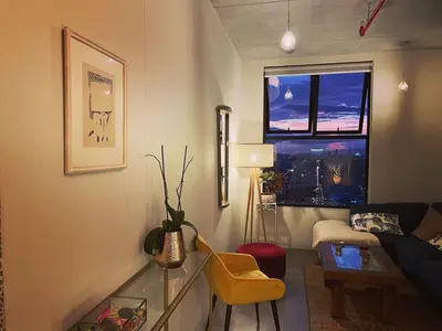 a living room with a couch and a window at Charming 3BR in Trendy Neighborhood in San José