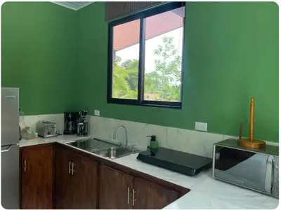 a kitchen with a sink and a window at Apartamentos zafiro in Bahia