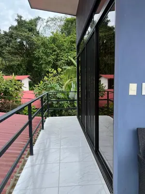 a balcony of a house with sliding glass doors at Apartamentos zafiro in Bahia