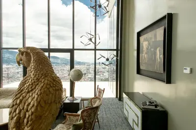a room with a large bird statue in front of a window at Cozy New Studio Excellent Location in San José