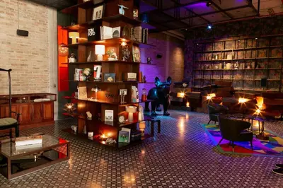 a room with a library with a statue of a dog on a shelf at Cozy New Studio Excellent Location in San José