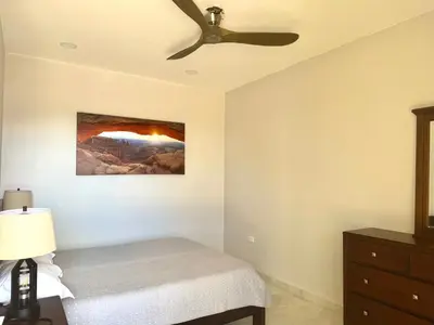 a bedroom with a bed and a ceiling fan at Casa Dorada 55 Studio in Marbella