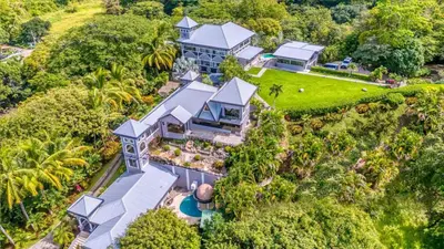 an aerial view of a house with a garden at Castillo Colonial Nosara - by Pura Villas in Nosara
