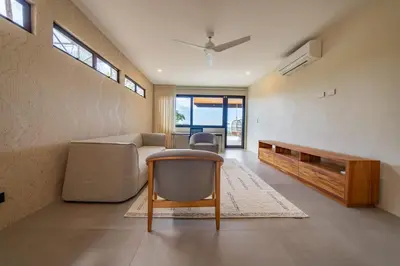 a living room with a couch and a table at Casa Vivo in Nosara