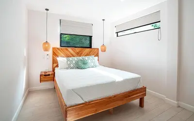 a bedroom with a bed and a window at Tropical 4BR Retreat with Private Pool Guest House in Tamarindo