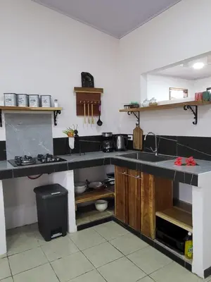 a kitchen with a sink and a counter top at Villa Milagro in Parrita
