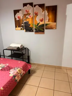 a room with four paintings on the wall at Sol y Mar Condominio don Roberto in Jacó