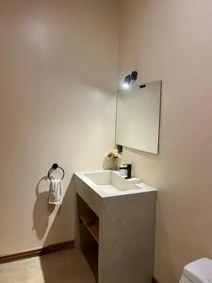 a bathroom with a sink and a mirror at Teva Guest House with Shared pool in Cabuya
