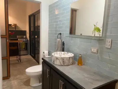 a bathroom with a sink and a toilet at Private Cabina at Yoga Center in Ojochal
