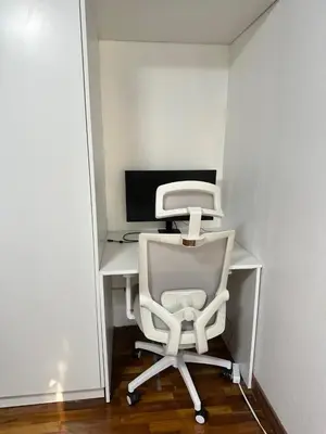 an office with a chair and a computer monitor at Rohrmoser Eucalipto Luxe Residence in San José