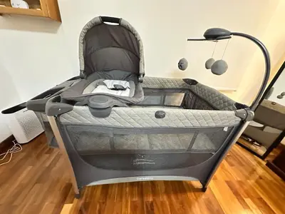 a baby stroller sitting in a room at Rohrmoser Eucalipto Luxe Residence in San José