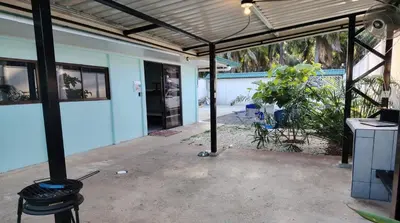 an empty patio with awning in front of a building at Villa Blue Vacations in Parrita