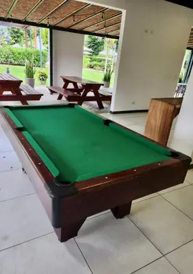 a pool table in a room with two picnic tables at Near from Beach- Cozy Herradura Tropical home in Herradura