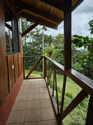 an outside view of a porch of a house at Ecos del Poás vista al jardín in Dulce Nombre