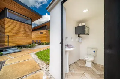 a bathroom with a toilet and a sink at Macondo Ecolodge Apt 4 - Estrella de Fuego in Coco