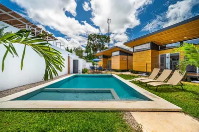 a swimming pool in the backyard of a house at Macondo Ecolodge Apt 4 - Estrella de Fuego in Coco