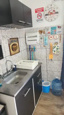 a kitchen with a sink and a counter top at Ecohacienda Perla Marina in Sardinal